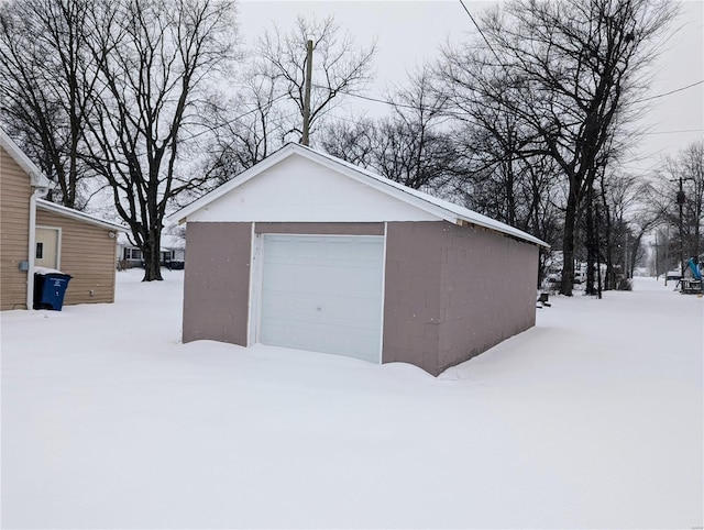 view of snow covered garage