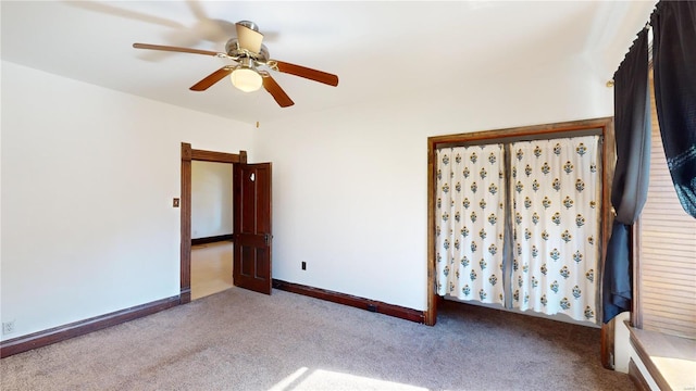 unfurnished bedroom featuring carpet flooring and ceiling fan