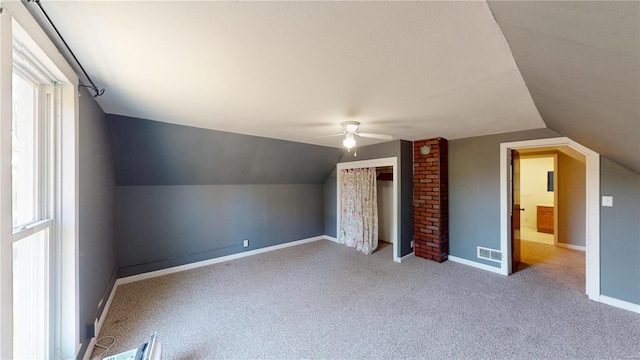 bonus room featuring carpet flooring, ceiling fan, and lofted ceiling