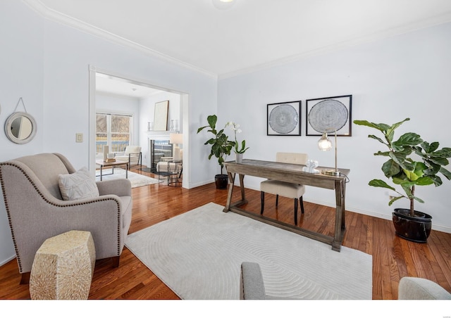 office area featuring wood-type flooring and ornamental molding