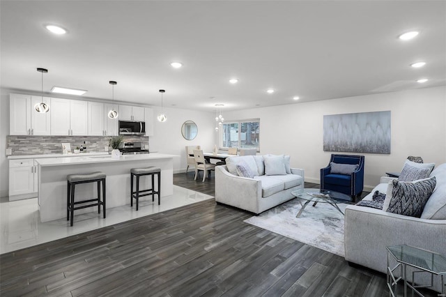 living room with dark wood-type flooring