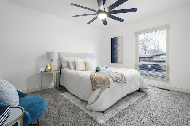 carpeted bedroom with ceiling fan