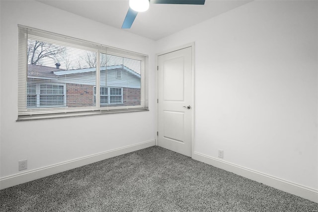 spare room featuring carpet flooring and ceiling fan