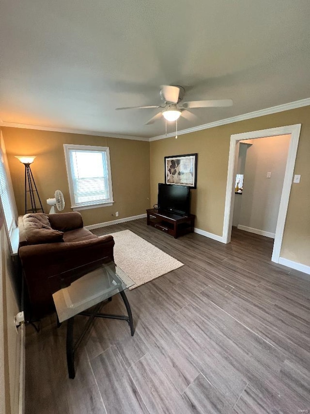 living room featuring ceiling fan, hardwood / wood-style floors, and ornamental molding