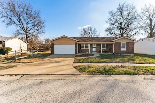 view of front of property featuring a front lawn and a garage