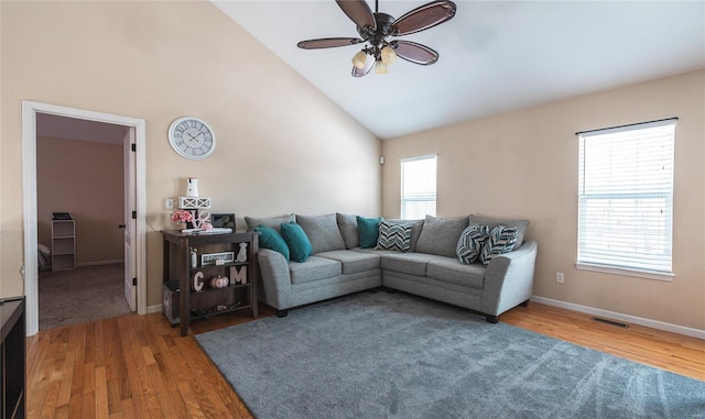 living room with ceiling fan, high vaulted ceiling, and hardwood / wood-style flooring