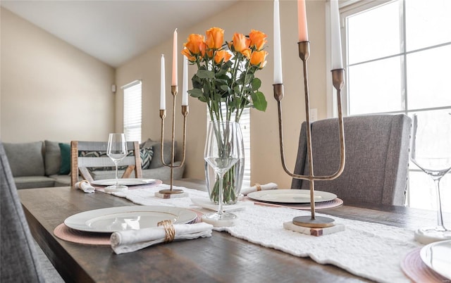 dining room featuring vaulted ceiling