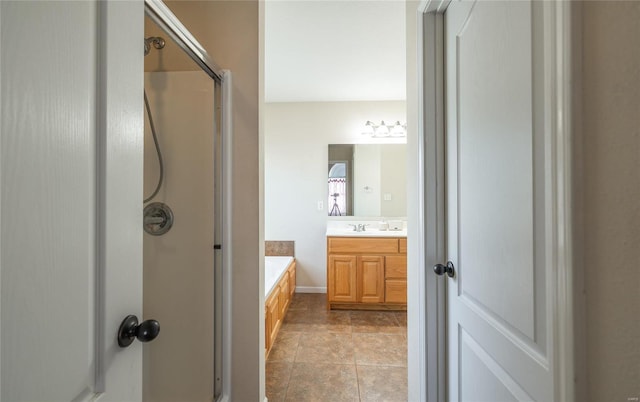 bathroom with vanity and independent shower and bath