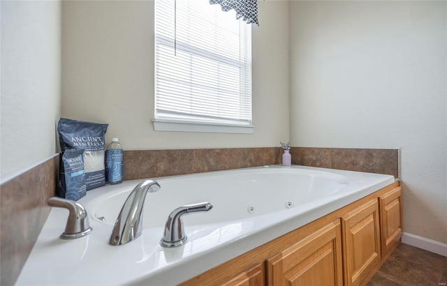 bathroom with a bathing tub and a wealth of natural light