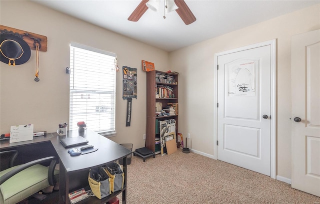 office area with light carpet, plenty of natural light, and ceiling fan