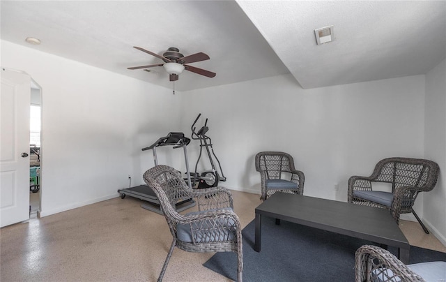 sitting room with a textured ceiling and ceiling fan