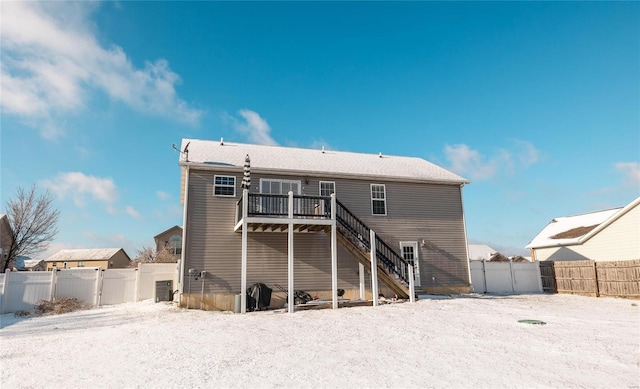 rear view of house featuring central AC unit