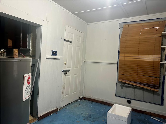 interior space with concrete floors and water heater