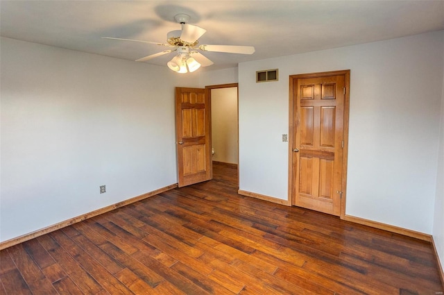 unfurnished bedroom with dark hardwood / wood-style floors and ceiling fan