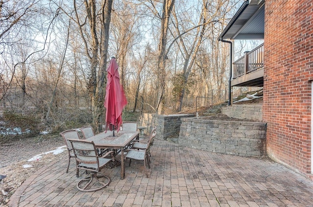 view of patio featuring a balcony