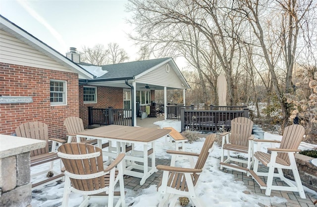 snow covered deck with ceiling fan