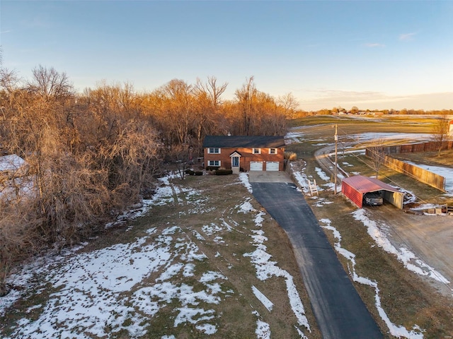 aerial view at dusk featuring a rural view