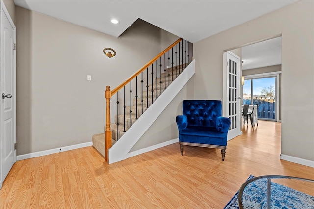 living area with hardwood / wood-style flooring