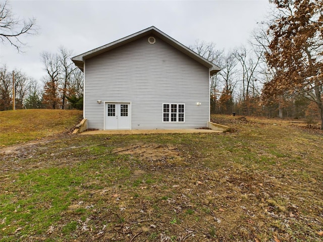 view of home's exterior with a yard