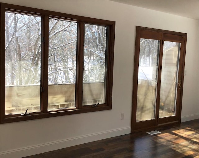 doorway to outside featuring dark hardwood / wood-style flooring