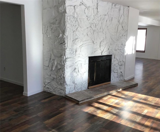 room details with a fireplace and wood-type flooring