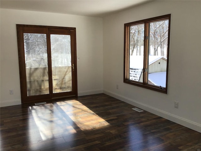 unfurnished room with dark hardwood / wood-style floors