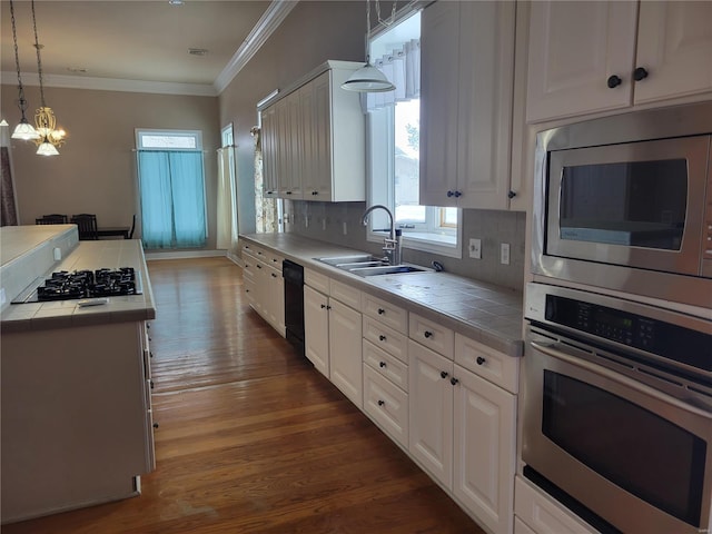 kitchen featuring white cabinetry, tile counters, and black appliances