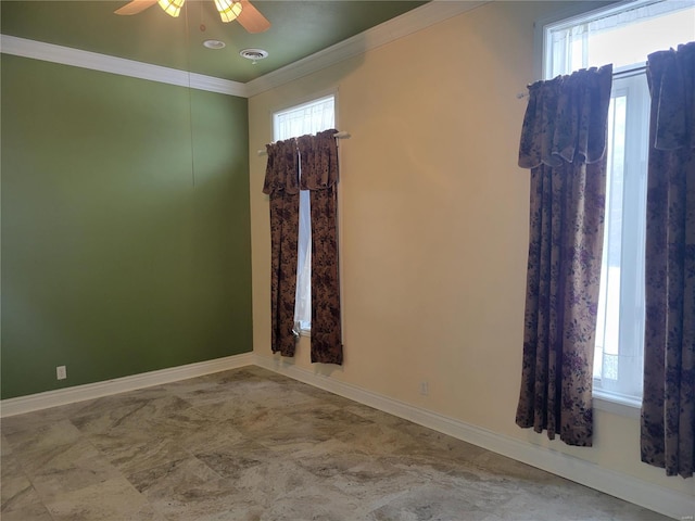 unfurnished room featuring ceiling fan, a healthy amount of sunlight, and ornamental molding