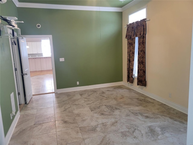 spare room featuring ornamental molding