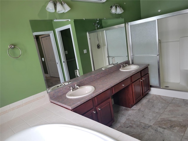 bathroom featuring vanity and a shower with shower door