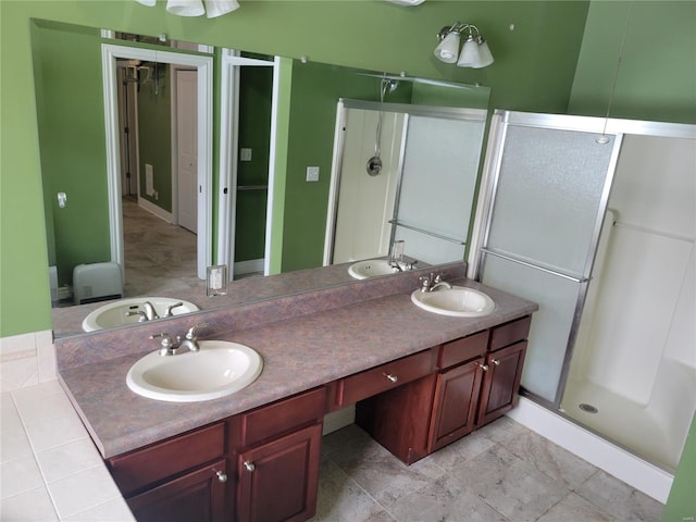 bathroom featuring vanity and an enclosed shower