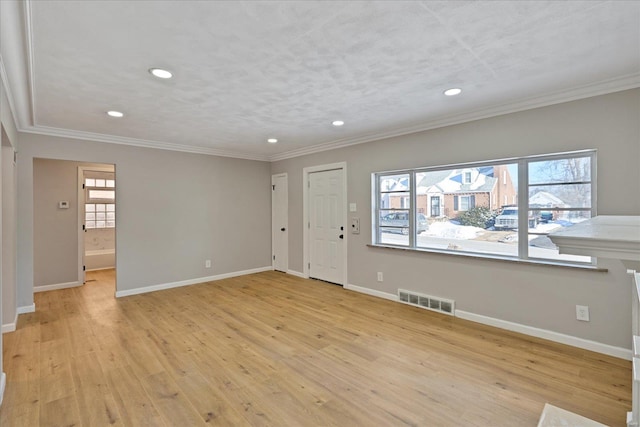 unfurnished room with light hardwood / wood-style flooring and ornamental molding