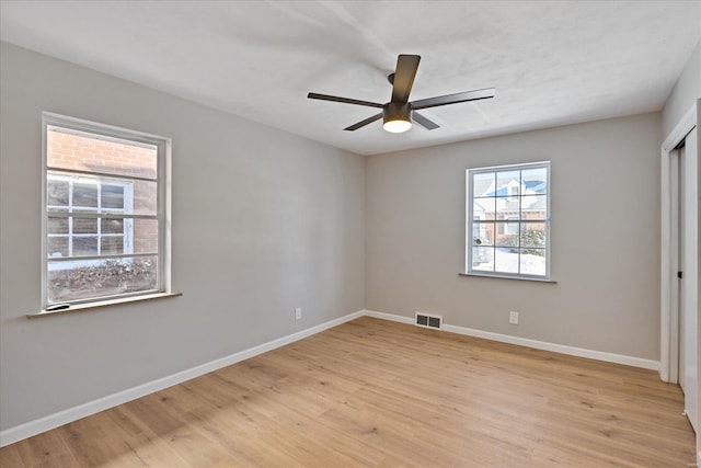 unfurnished bedroom with ceiling fan and light hardwood / wood-style floors