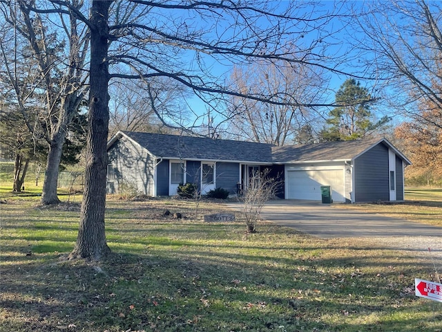 view of front facade with a front yard and a garage