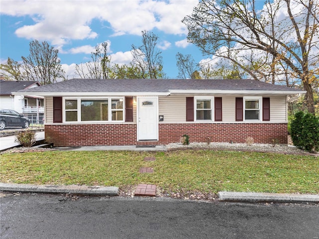 ranch-style home with a front yard