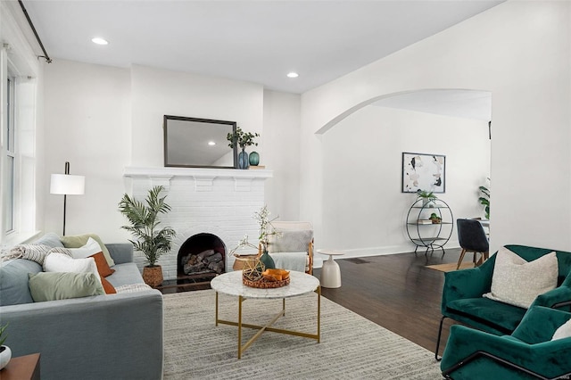 living room featuring a fireplace and hardwood / wood-style floors