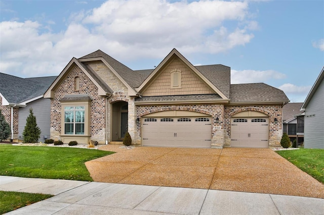 craftsman-style house with a front yard and a garage