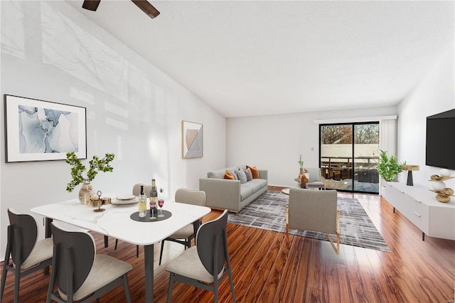 living room with wood-type flooring and lofted ceiling