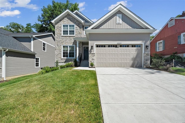 view of front of property featuring a garage and a front lawn