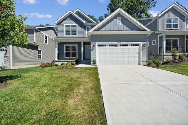 craftsman house featuring a porch, a front yard, and a garage