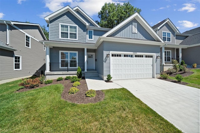 craftsman-style home with a garage, a porch, cooling unit, and a front lawn