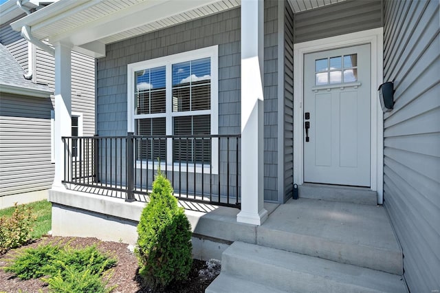 doorway to property featuring covered porch