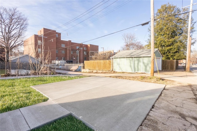 view of patio featuring a garage and an outdoor structure