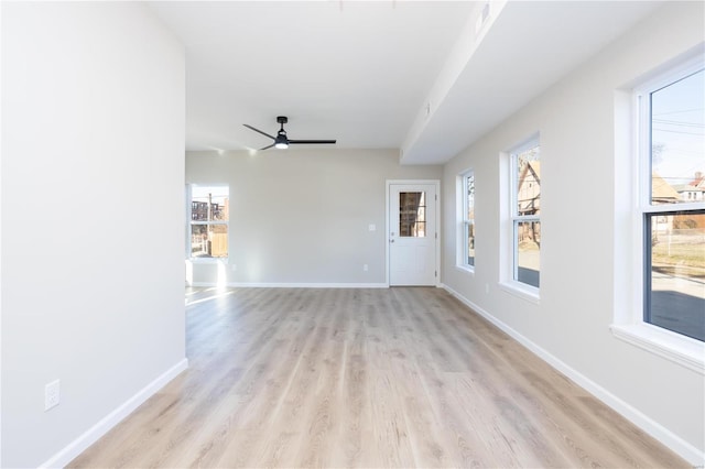 spare room featuring ceiling fan and light hardwood / wood-style floors