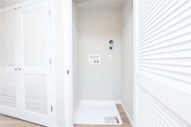 laundry room featuring washer hookup, light hardwood / wood-style flooring, and electric dryer hookup