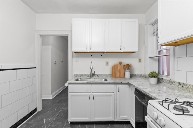 kitchen with dishwasher, sink, light stone countertops, tile walls, and white cabinetry