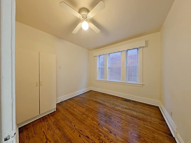 unfurnished room featuring ceiling fan and wood-type flooring