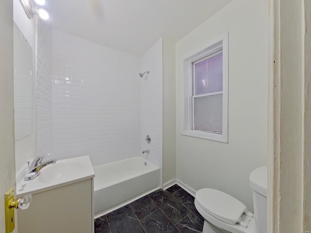 full bathroom featuring vanity, toilet, and tiled shower / bath combo