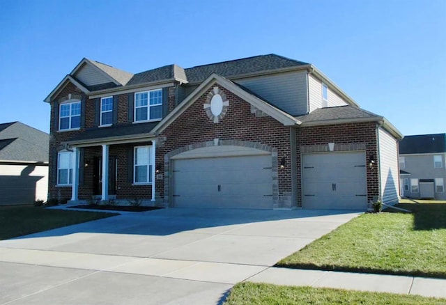 view of front of house with a front yard and a garage