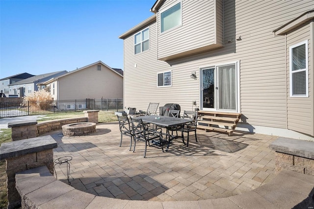 view of patio / terrace featuring an outdoor fire pit